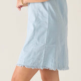 Light blue twill dress with frayed hem and vertical seams