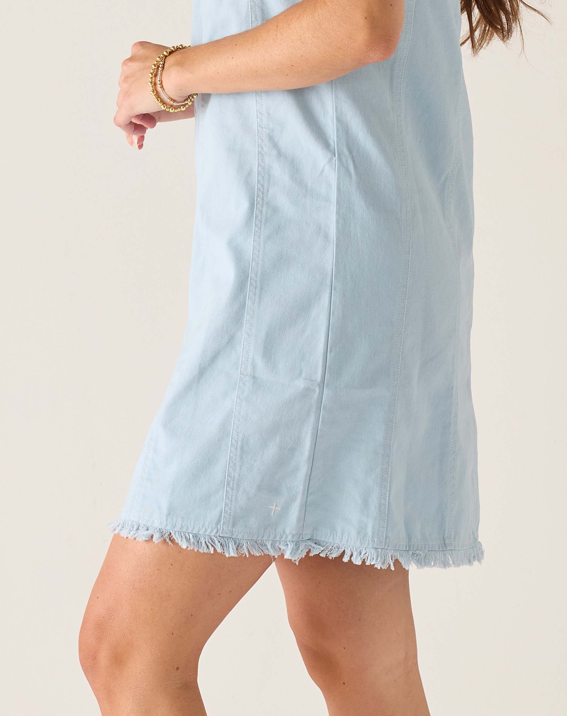 Light blue twill dress with frayed hem and vertical seams