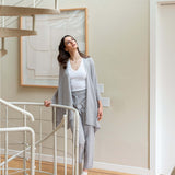 Woman standing on a staircase in a home interior