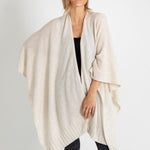 woman wearing mersea luxy wrap in cream