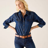 Night rain blue button-up shirt with breast pockets and rolled sleeves paired with denim jeans.