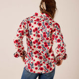 Red and navy poppy floral print button-up shirt with puff sleeves and elastic cuffs, back view.