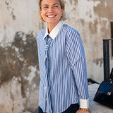 Blue and white double striped button-up shirt with a matching tie detail.