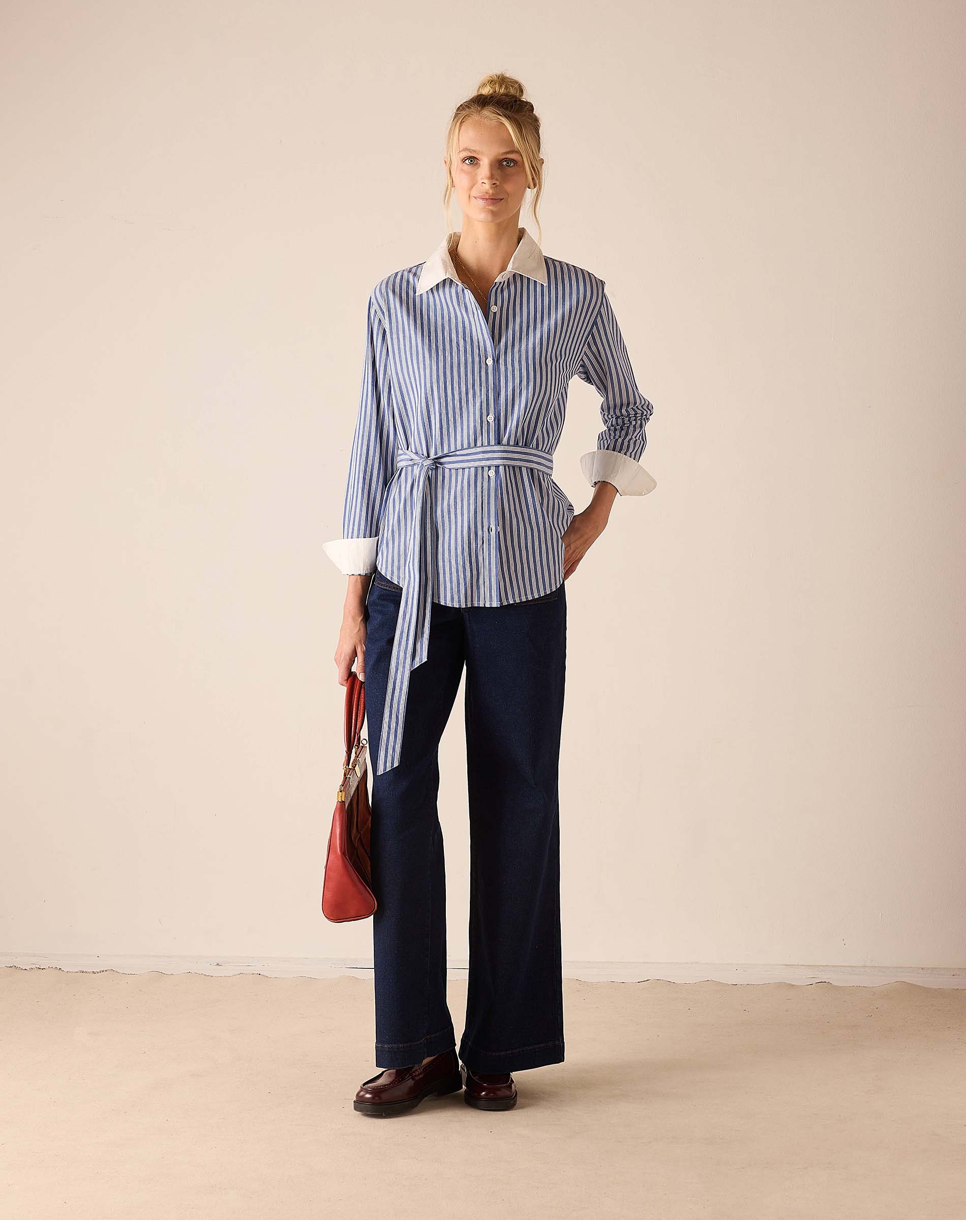 Blue double stripe button-up shirt with a white collar and wide sleeves.