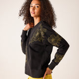 Military green oversized fit cotton blend sweatshirt featuring large gold daisy flower embroidery