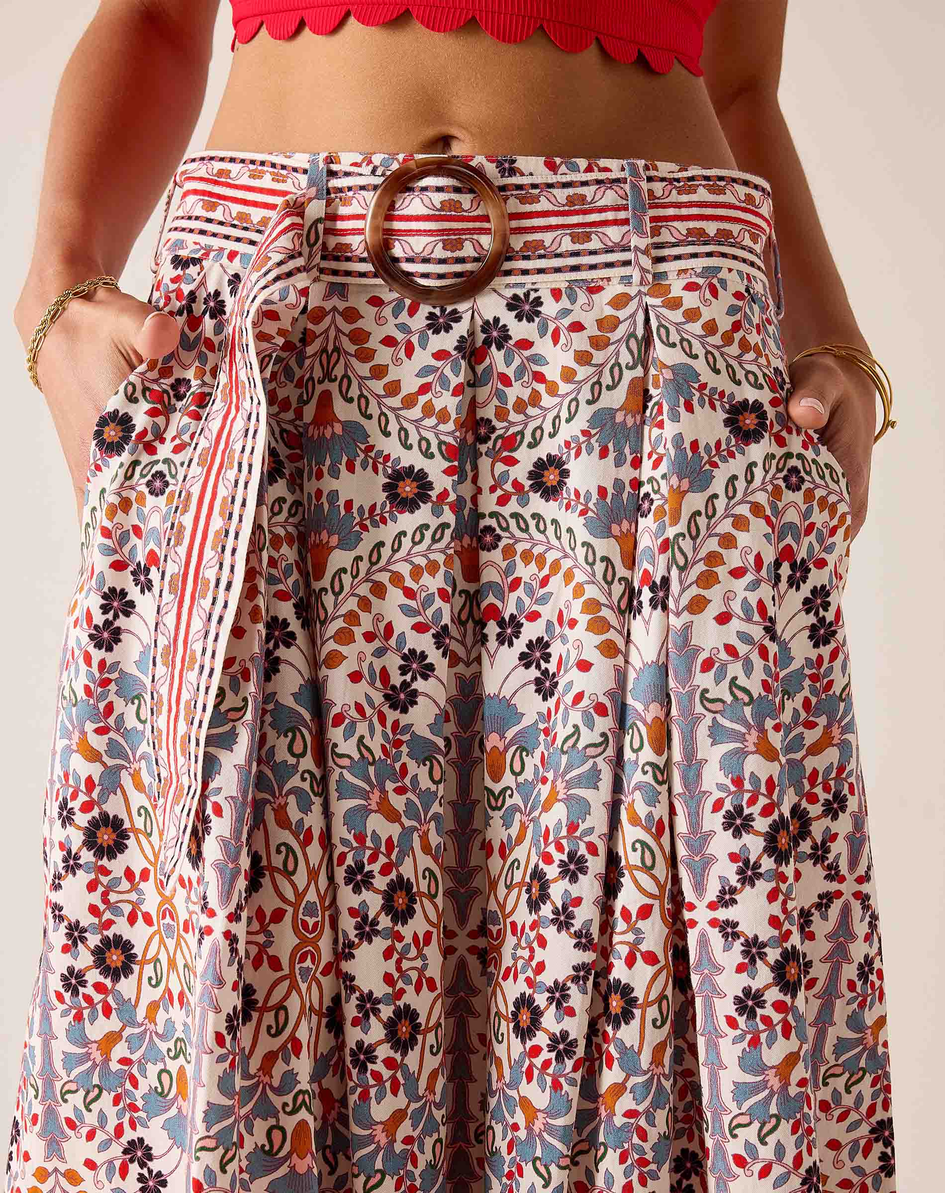 Multi-colored arched floral print maxi skirt with a belt and high waist