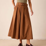 Saddle brown high-waisted pleated midi skirt with a belt and center seam.