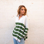 woman showcasing mersea marina polo sweater in green and sea salt stripe