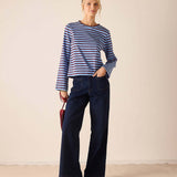 Women's travel-friendly plum and berry striped crewneck tee made of soft knit fabric.