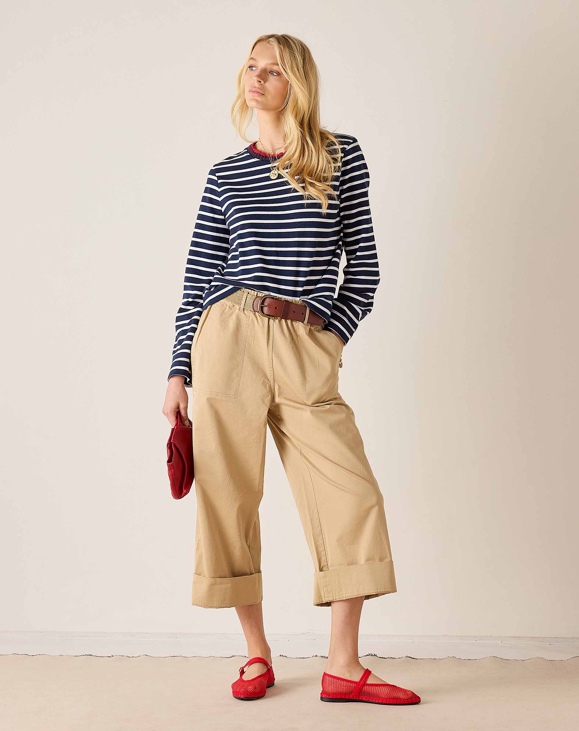 Women's travel-friendly navy and white stripe cotton tee with a boat neck and matching trousers.