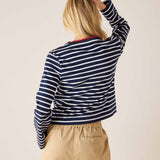 Navy and white striped long-sleeve tee with a boatneck and red trim detail.