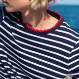 Navy and white sailor stripe cotton tee with a red ribbed trim detail.