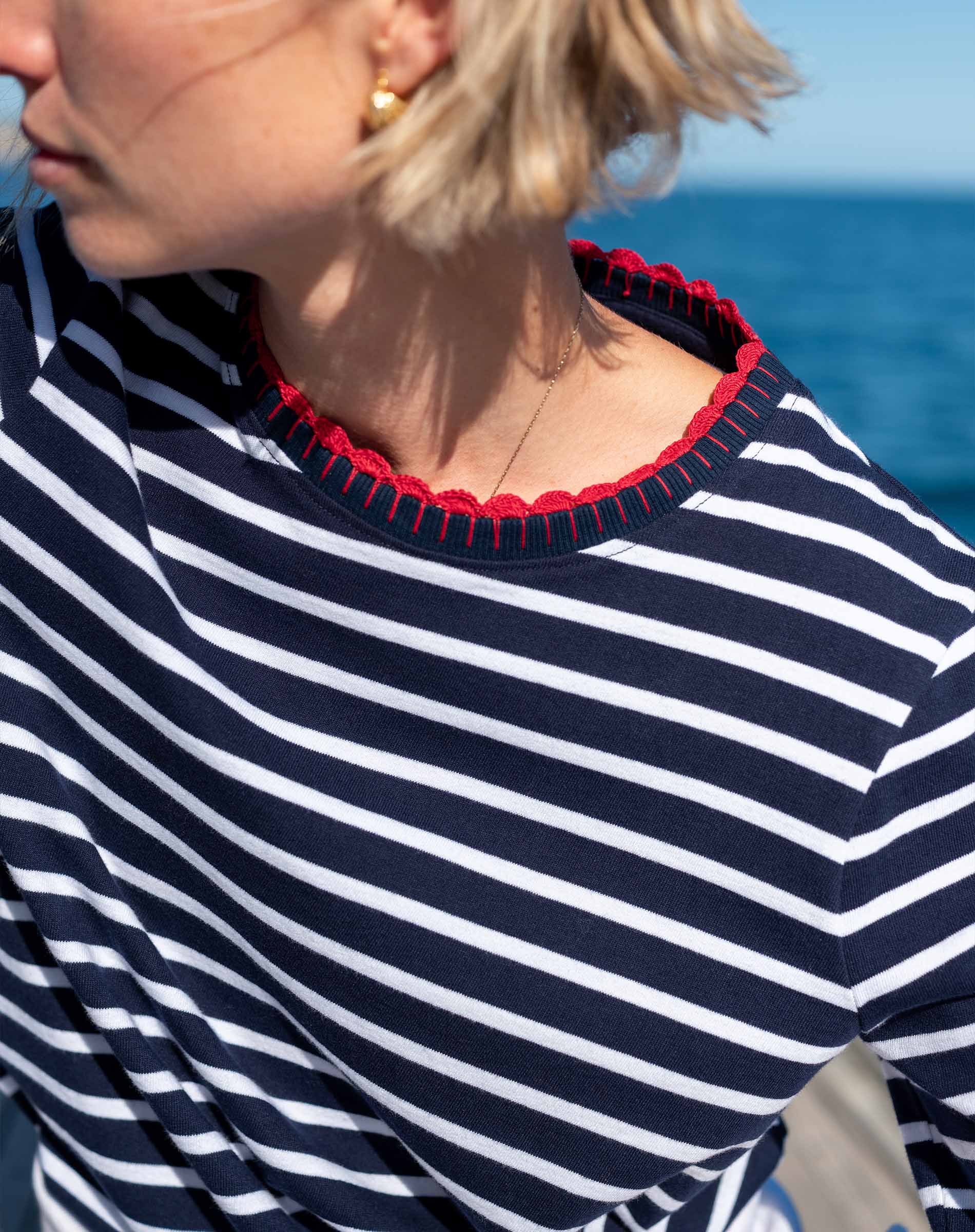 Navy and white sailor stripe cotton tee with a red ribbed trim detail.