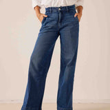 Deep indigo blue wide-leg denim trousers featuring a relaxed fit and subtle fading.