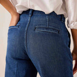 Pacific blue high-waisted denim-style trousers with seam detailing and front pockets.