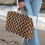 female holding medium sized straw bag with navy leather handles and a navy checkered print on beach