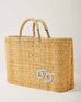 Market straw basket with tan leather handles and Cancer symbol embroidered in light blue