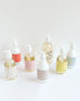 various liquid hand soaps and lotions  laying on a white background