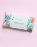 close up of eye pillow with tag in block print poppy pattern