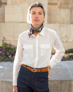 Ladies' travel-ready white button-down shirt with double chest pockets and a linen fabric feel.
