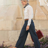 White button-up cotton shirt with double pockets and a tailored fit.