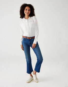 woman showcasing white mersea modern oxford tee button down