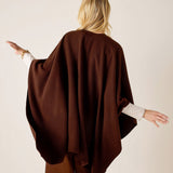 Back view of the chocolate brown textured knit travel wrap.
