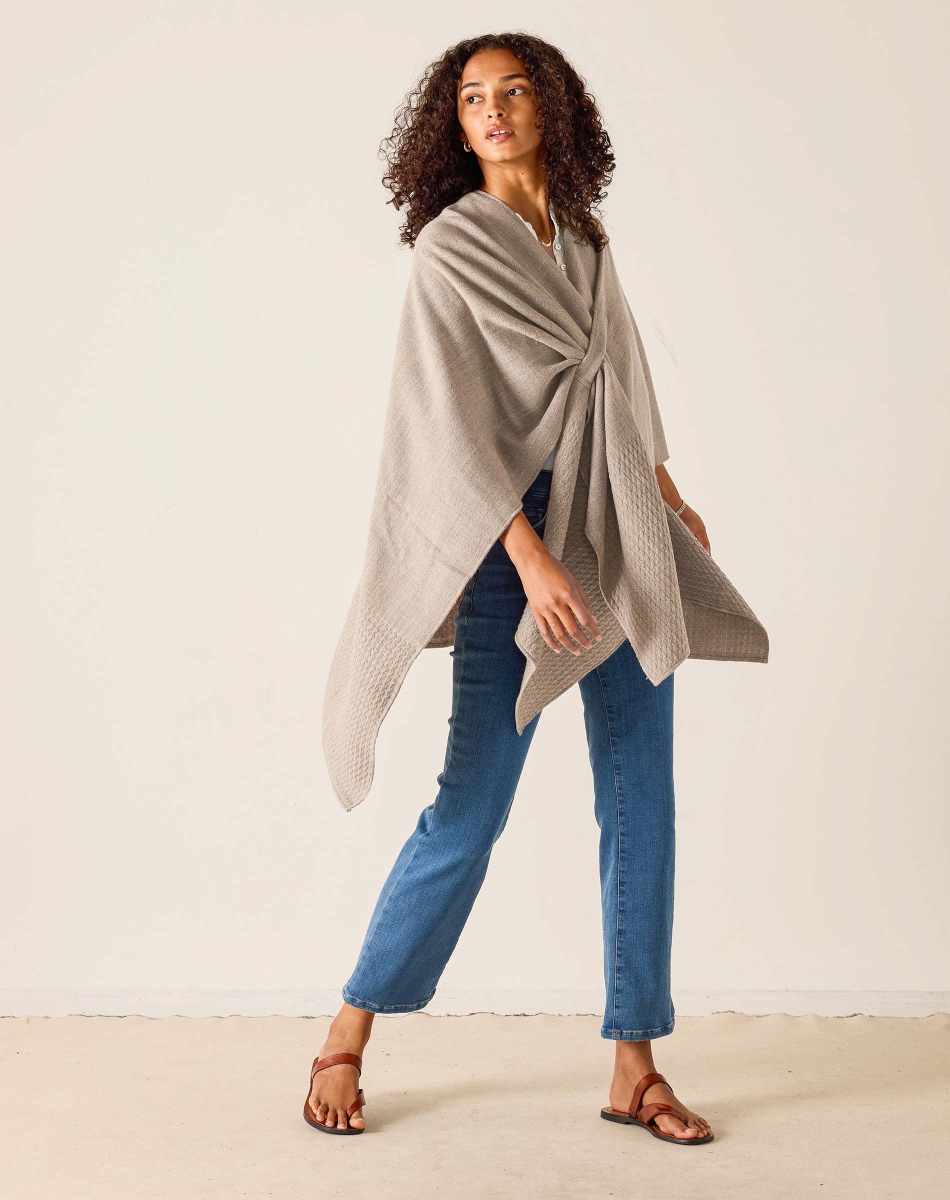 Driftwood wrap with a textured knit and oversized drape.