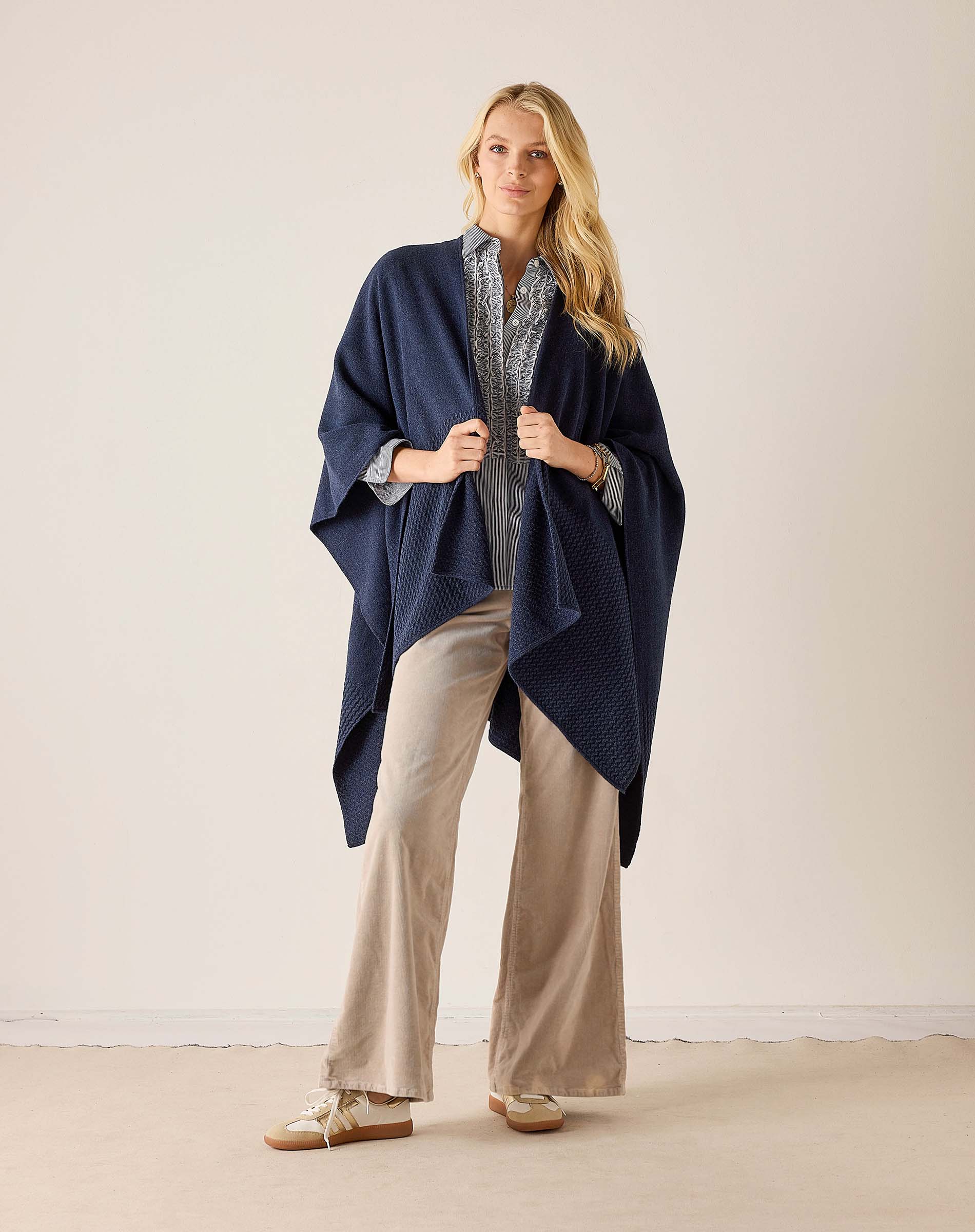 Navy blue textured travel wrap with open sides and a longline silhouette.
