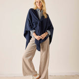 Navy blue travel wrap in a chunky knit texture with a draped front.