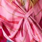 Peppermint plaid oversized wrap in soft knit fabric featuring a draped front design.
