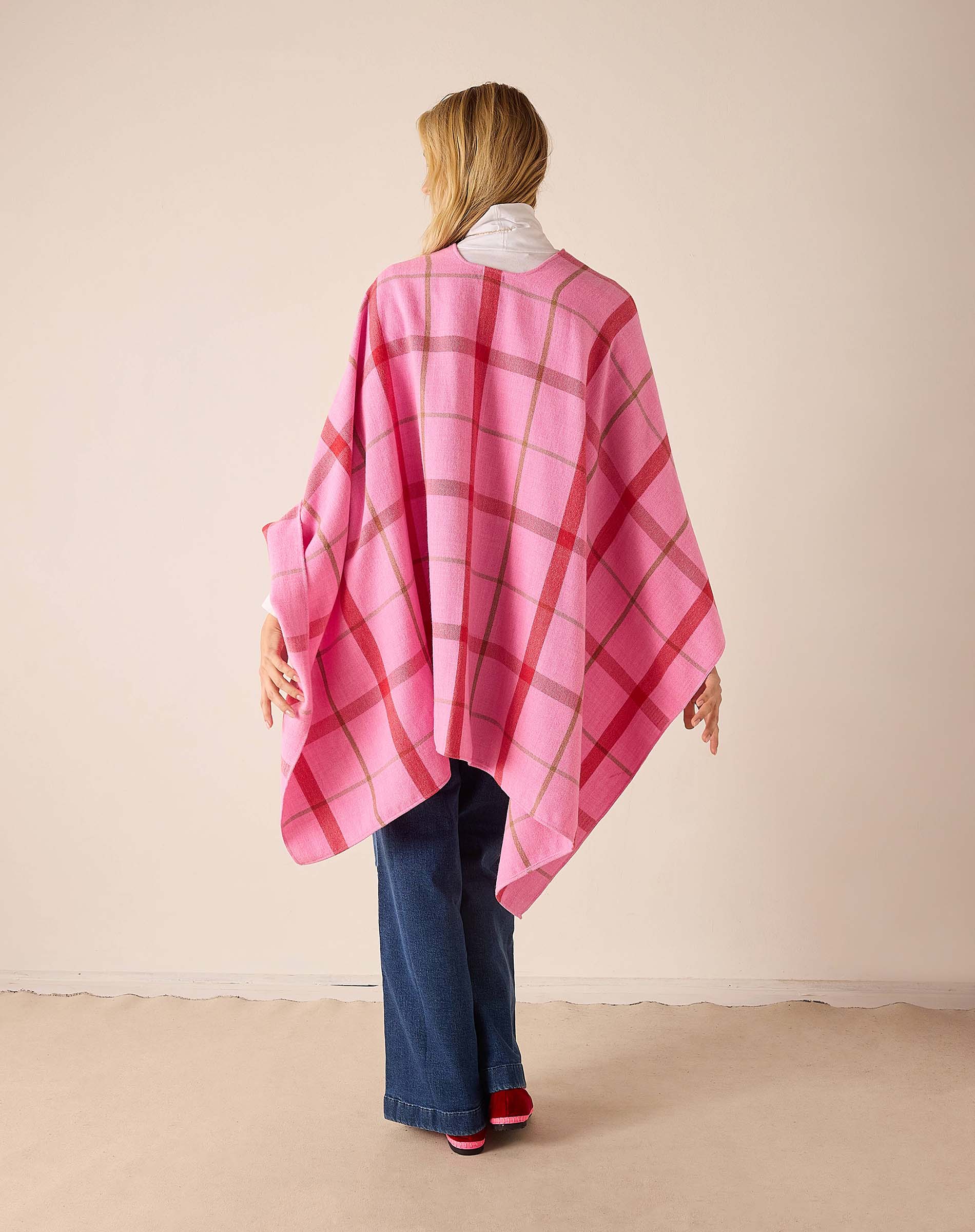 Back view of women's travel-friendly peppermint plaid oversized wrap with a wide-spread silhouette.