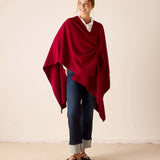 Wine-colored knit travel wrap with a draped silhouette and wide hem.