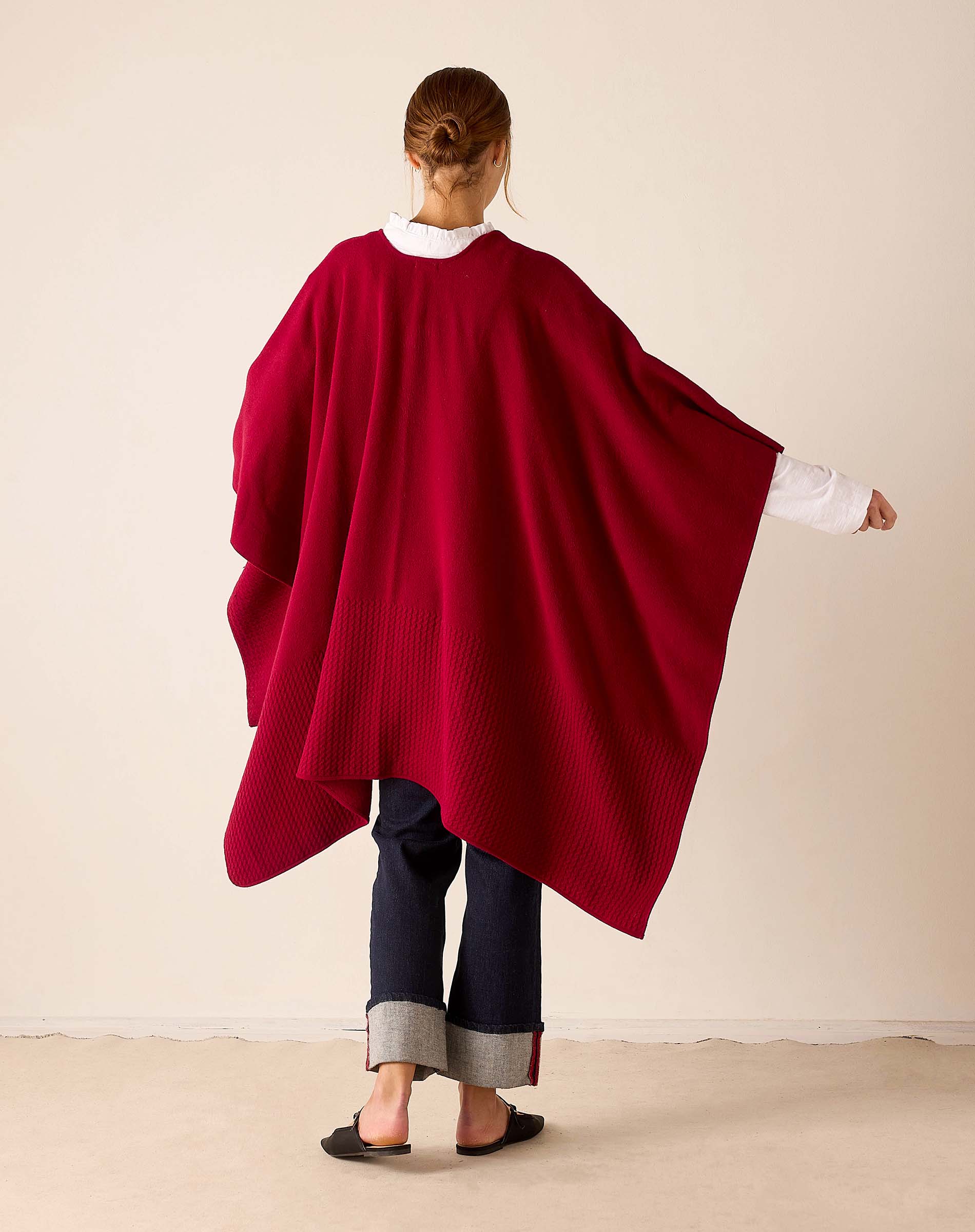 Back view of the wine-colored ribbed knit travel wrap.