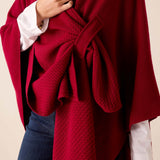 Wine-colored textured knit travel wrap with a tie waist and matching belt.