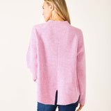 Back view of women's travel-friendly heathered dewy pink mockneck ribbed sweater with center back slit