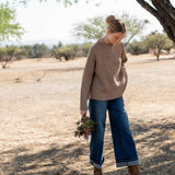 Women's travel-friendly heathered driftwood mockneck knit sweater with a soft ribbed texture.