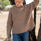 Heathered driftwood mockneck sweater in a ribbed knit.