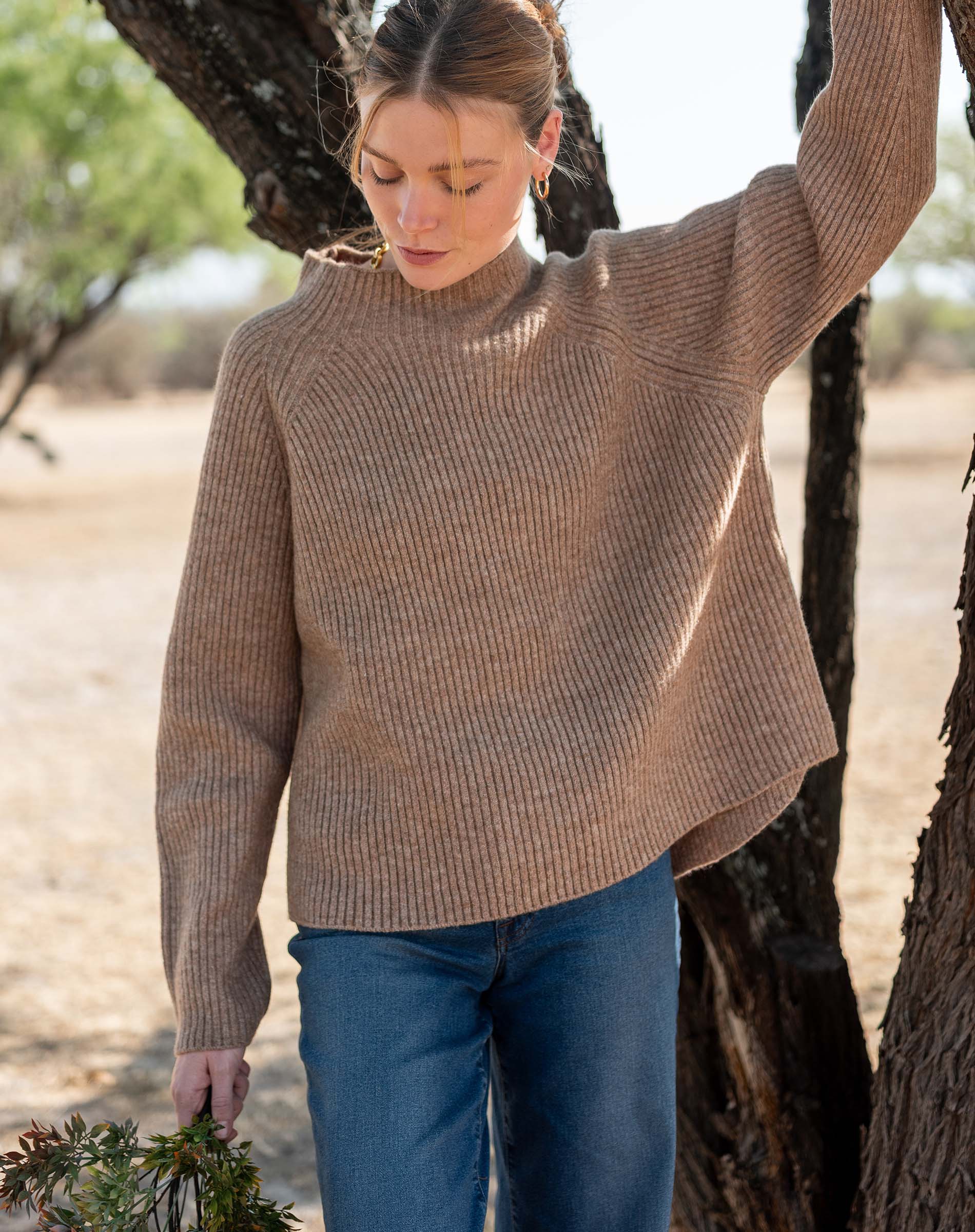 Heathered driftwood mockneck sweater in a ribbed knit.