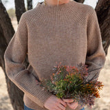 Heathered driftwood mockneck sweater in a ribbed knit.