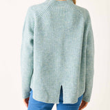 Heathered sea foam mockneck sweater with a ribbed texture and split back hem.