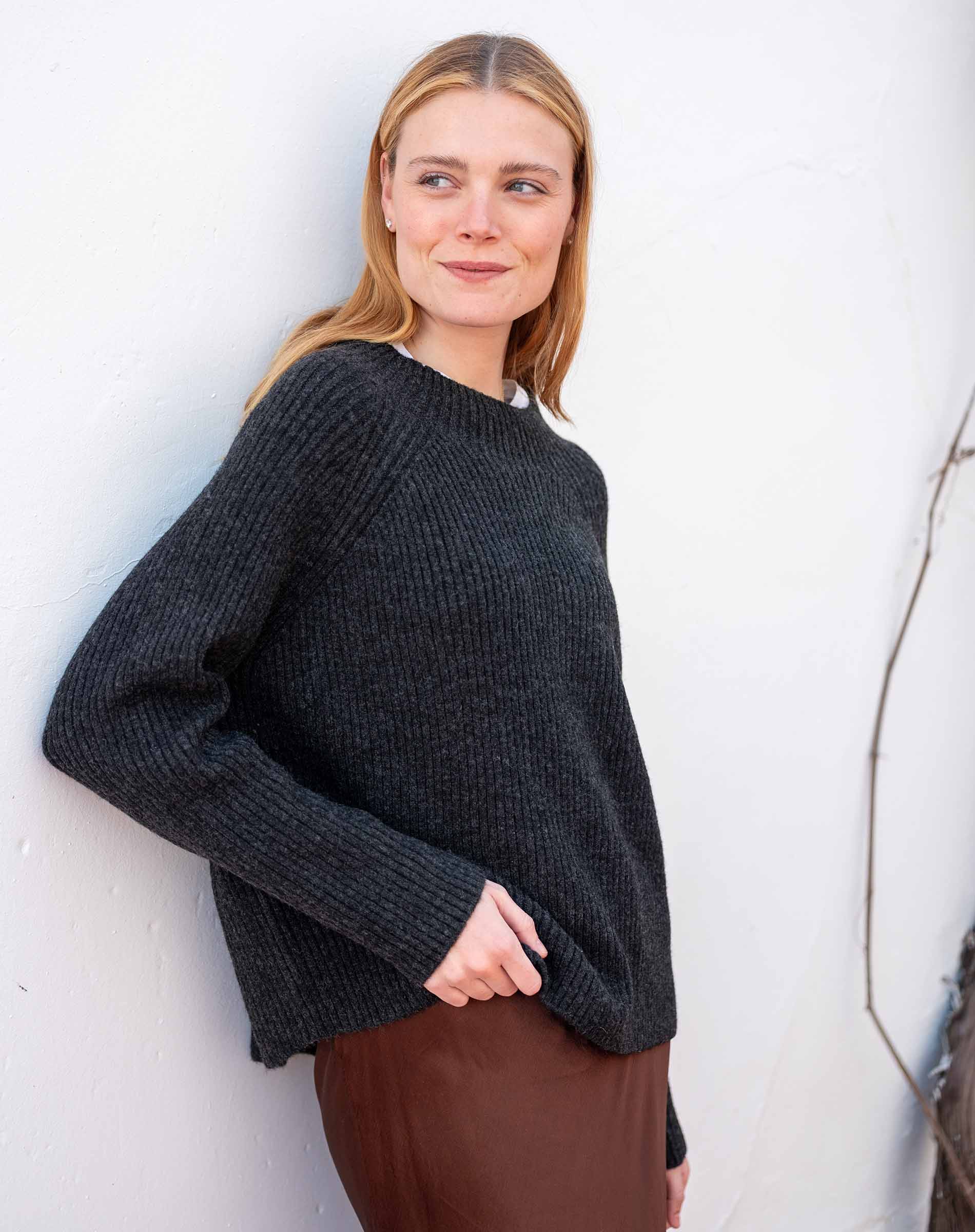 Graphite ribbed knit sweater with a wide boat neck and dropped shoulders.