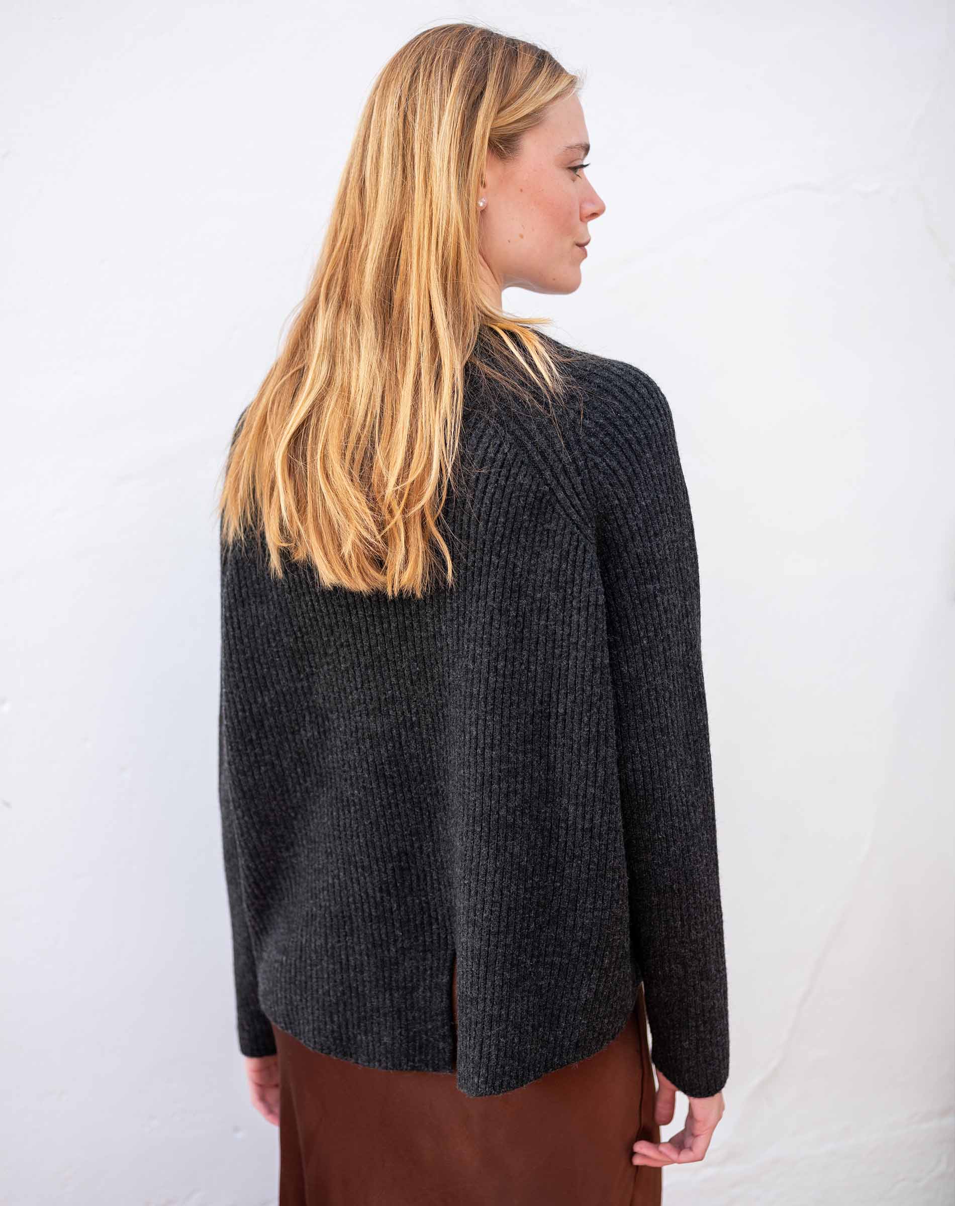 Graphite ribbed knit sweater with a draped back detail.