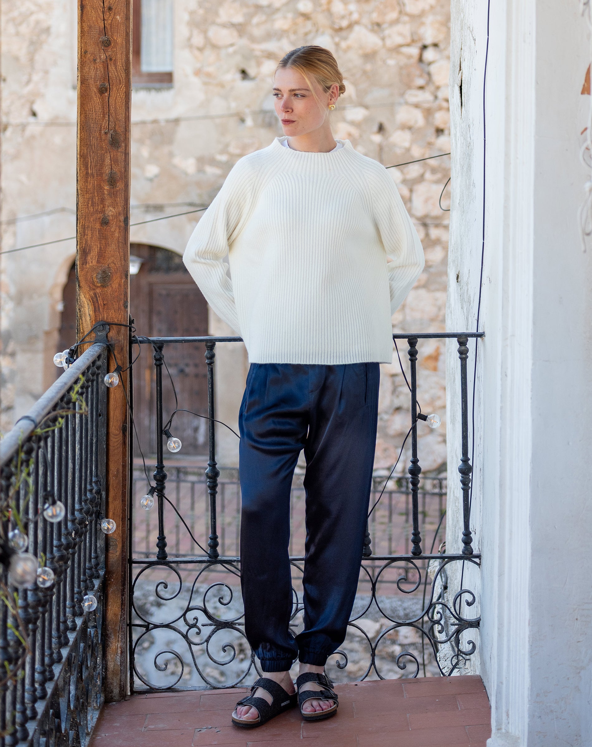 Ladies' travel-ready winter white ribbed knit sweater with oversized fit and drop shoulders.