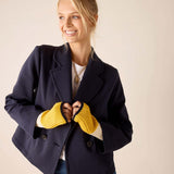 Ladies' travel-ready golden yellow knit fingerless gloves with ribbed texture.