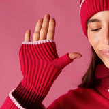 Raspberry pink ribbed knit fingerless gloves with a white stripe detail.