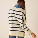 Back view of women's travel-friendly cream and navy striped knit top with golden accents.