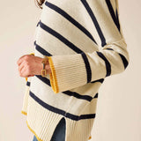Cream knit sweater with navy and yellow stripes and a v-neck