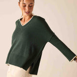 Forest green v-neck knit sweater with a relaxed fit and wide ribbed cuffs.