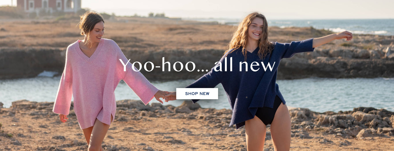 yoo-hoo...all new - Shop NEW - two females wearing montauk v neck sweater walking on a rocky coast